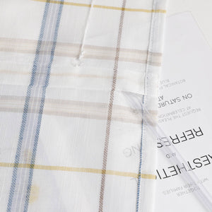 Roman Shade with V-Shaped Tab Tops in Linen-Look Fabric with Check Pattern